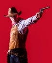 Man wearing cowboy hat, gun. West, guns. Portrait of a cowboy. American bandit in mask, western man with hat. Portrait