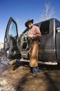 Man Wearing Cowboy Hat With Lariat and Truck Royalty Free Stock Photo