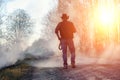 A man is wearing a cowboy hat and a loso in the field. American