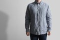 Man wearing creased shirt on light background, closeup. Space for text Royalty Free Stock Photo