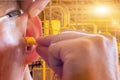 Man wearing ear plugs hearing protection for factory worker,safety concept Royalty Free Stock Photo