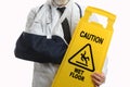 Man Wearing Elbow Sling with Caution Sign Royalty Free Stock Photo