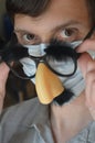 Man wearing face mask and Groucho glasses