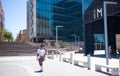 Man wearing face mask walking toward the Silo District in Cape Town. Royalty Free Stock Photo