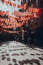 Man wearing a face mask walks in largely empty Chinatown area in London, UK