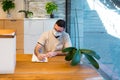 Man wearing a face mask while working in the reception area of a medical center. Royalty Free Stock Photo