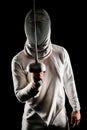 Man wearing fencing suit practicing with sword