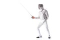 Man wearing fencing suit practicing with sword