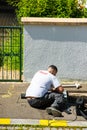 Man wearing Free Telecom t-shirt installing fiber optic Royalty Free Stock Photo