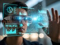 Man wearing futuristic virtual reality goggles and interacting with digital interface Royalty Free Stock Photo