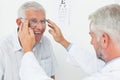 Man wearing glasses after taking vision test at doctor