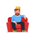Man wearing gold crown sitting on home arm chair
