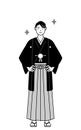 Man wearing Hakama with crest with his hands on his hips