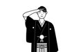Man wearing Hakama with crest making a salute