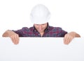 Man Wearing Hard Hat Holding Placard Royalty Free Stock Photo