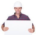 Man Wearing Hard Hat Holding Placard Royalty Free Stock Photo