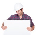 Man Wearing Hard Hat Holding Placard Royalty Free Stock Photo