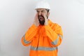 Man wearing hardhat and reflecting jacket hard mad screaming frustrated furious shouting anger rage.