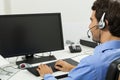 Man wearing headset giving online chat and support