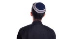 Man wearing kipa seen from the back, white background. religious person seen from behind.