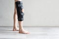 Man wearing knee brace closeup. Help promote recovery of bones, muscles, ligaments Royalty Free Stock Photo