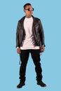 Man wearing leather faux leather jacket and white t shirt isolated on background. Royalty Free Stock Photo