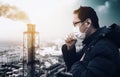 Man wearing mask against smog and air pollution factory background