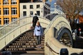 Man wearing mask on Half Penny Bridge Dubliin