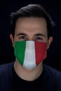 Man Wearing A Mask For Protection With Italy Flag Form Corona Virus Covid-19 Royalty Free Stock Photo