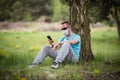 Man wearing a mask with smartphone