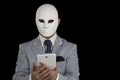 Man wearing mask texting on smart phone, Royalty Free Stock Photo