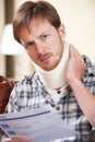 Man Wearing Neck Brace Reading Claim Letter Royalty Free Stock Photo