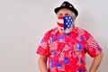 Man wearing patriotic shirt and face mask