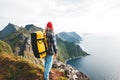 Traveler standing on the edge cliff rock above sea and enjoying epic view Royalty Free Stock Photo