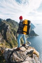 Traveler standing on the edge cliff rock above sea and enjoying epic view Royalty Free Stock Photo