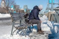 Man wearing a protection mask and sitting on bench Royalty Free Stock Photo