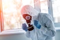 Man wearing protective biological suit and gas-mask due to mers coronavirus global pandemic warning and danger. Medic sphysician Royalty Free Stock Photo