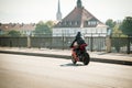 Man wearing protective clothes and helmet on a Ducatti motorcycle Royalty Free Stock Photo