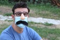 Man wearing protective mask with funny complements