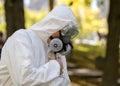 Man wearing Protective Suit And Mask