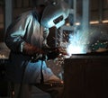 Man welding sheet matal using arc welding