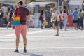 A man wearing rainbow socks and bag at the pride festival