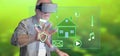 Man wearing a reality virtual headset touching a digital smart home automation concept on a touch screen