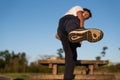 A man wearing running shoes with worn-out outsole is kicking in the air Royalty Free Stock Photo