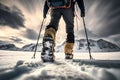 A man wearing snowshoes hikes in the snow-covered mountains