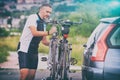 Man loading bicycles on the bike rack Royalty Free Stock Photo