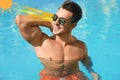 Man wearing sunglasses in outdoor swimming pool. UVA and UVB rays reflected by lenses, illustration