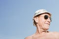 Man wearing sunhat and sunglasses