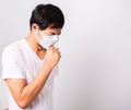 Man wearing surgical hygienic protective cloth face mask against coronavirus he sneeze Royalty Free Stock Photo