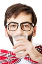 Man wearing suspenders drinking milk. Royalty Free Stock Photo